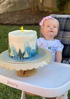a girl with a rare genetic condition celebrating her first birthday